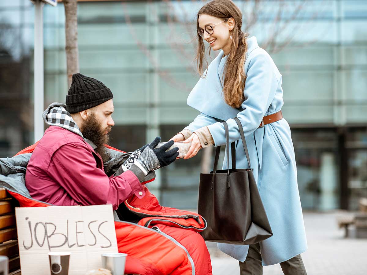 woman-giving-food-to-a-homeless-beggar.jpg